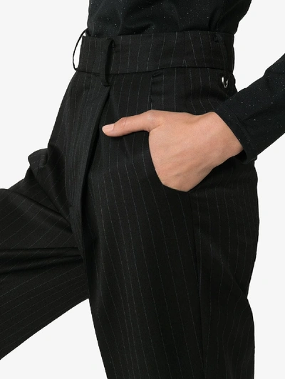 Shop Ader Error Pinstripe Flared Wool Blend Trousers In Black