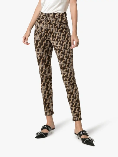 Shop Fendi Slim Fit Logo Trousers In Brown