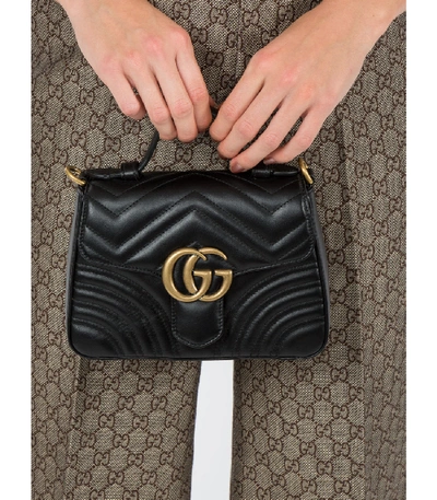 Shop Gucci Gg Marmont Mini Top Handle Bag In Black