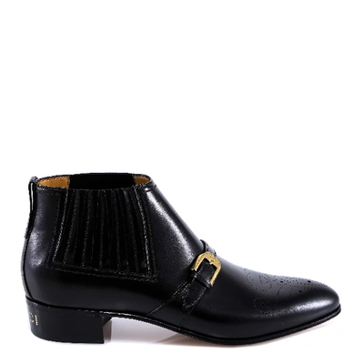 Shop Gucci G Brogue Ankle Boots In Black