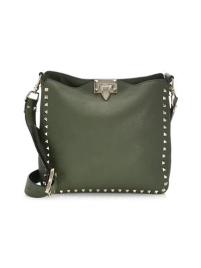 Shop Valentino Rockstud Small Leather Hobo Bag In Army Green