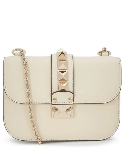 Shop Valentino Small Leather Rockstud Cross-body Bag In Light Ivory