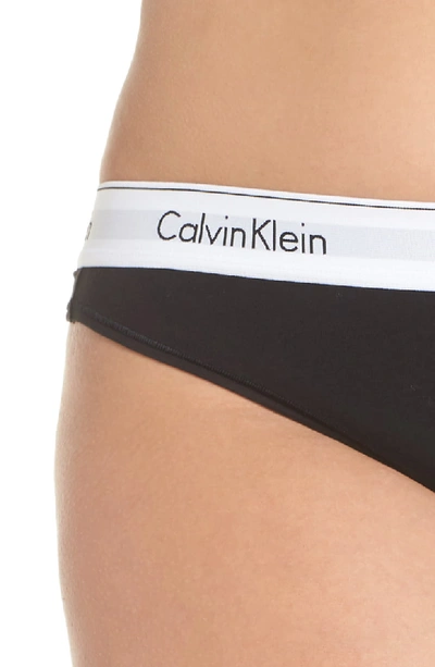 Shop Calvin Klein Modern Cotton-blend Thong In Black