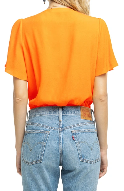 Shop Astr Cory Tie Front Bodysuit In Clementine