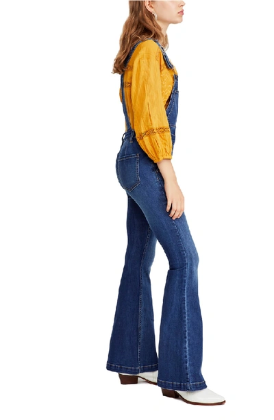 Shop Free People Carly Flare Overalls In Blue