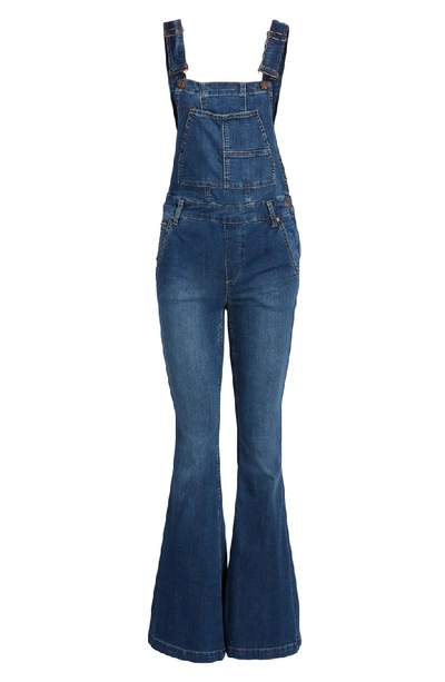 Shop Free People Carly Flare Overalls In Blue