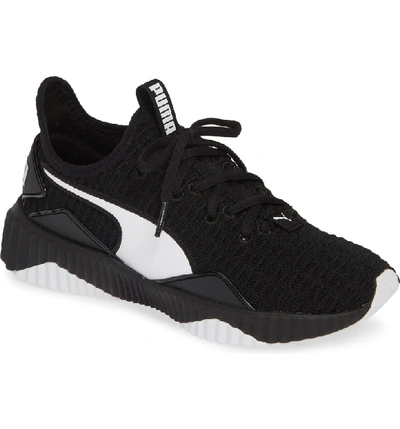 Shop Puma Defy Sneaker In Black/ White