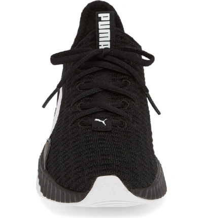 Shop Puma Defy Sneaker In Black/ White