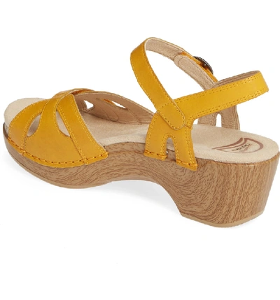 Shop Dansko Season Sandal In Mango Leather