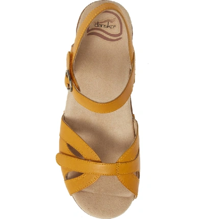 Shop Dansko Season Sandal In Mango Leather