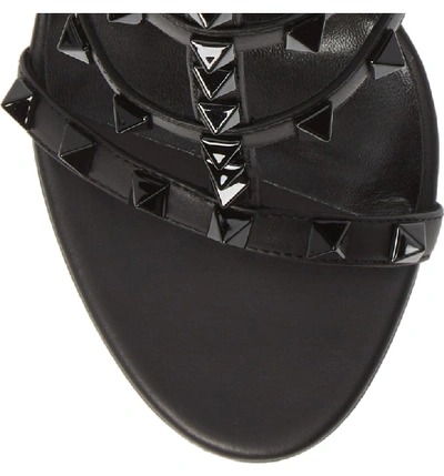 Shop Valentino Rockstud T-strap Sandal In Black