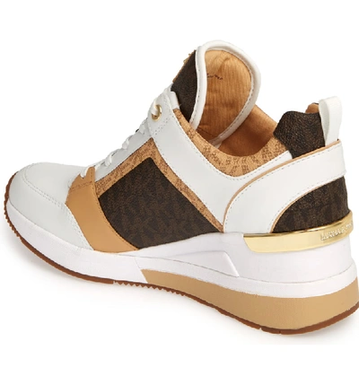 Shop Michael Michael Kors Georgie Wedge Sneaker In Butternut Leather
