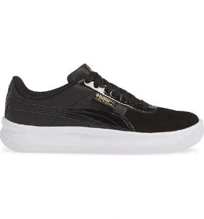 Shop Puma California Sneaker In Black/ Team Gold