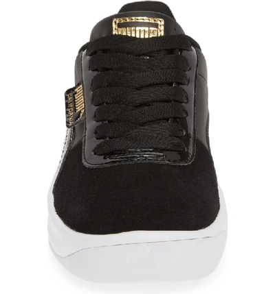 Shop Puma California Sneaker In Black/ Team Gold