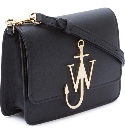 Shop Jw Anderson Logo Leather Crossbody Bag - Black In Black/ Gold
