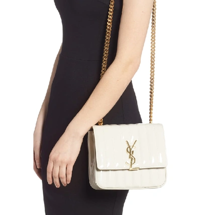 Shop Saint Laurent Medium Vicky Patent Leather Crossbody Bag In Crema Soft