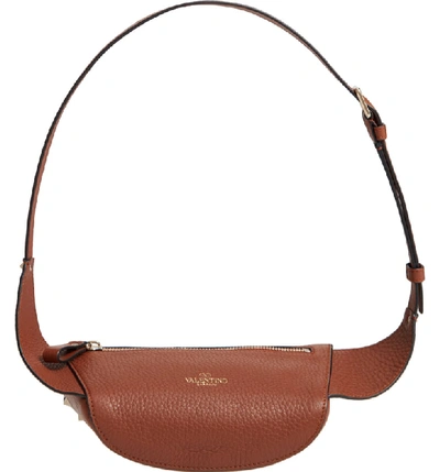 Shop Valentino Rockstud Belt Bag In Bright Cognac