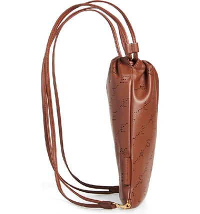 Shop Stella Mccartney Perforated Logo Mini Faux Leather Drawstring Backpack - Brown In Cinnamon