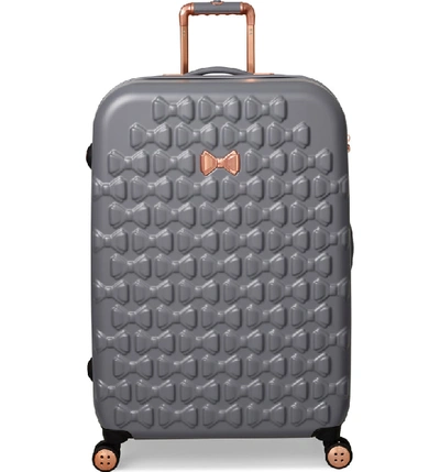 Shop Ted Baker Medium Beau Bow Embossed Four-wheel 27-inch Trolley Suitcase - Grey