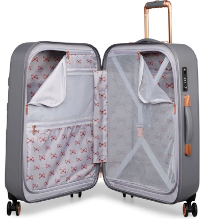 Shop Ted Baker Medium Beau Bow Embossed Four-wheel 27-inch Trolley Suitcase - Grey