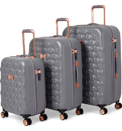 Shop Ted Baker Medium Beau Bow Embossed Four-wheel 27-inch Trolley Suitcase - Grey