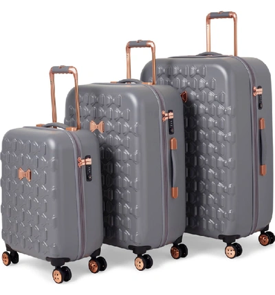 Shop Ted Baker Large Beau Bow Embossed Four-wheel 31-inch Trolley Suitcase - Grey