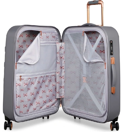 Shop Ted Baker Large Beau Bow Embossed Four-wheel 31-inch Trolley Suitcase - Grey