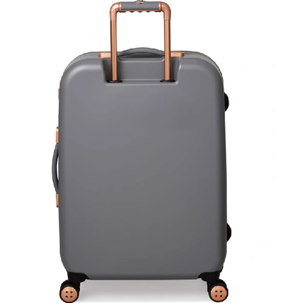 Shop Ted Baker Large Beau Bow Embossed Four-wheel 31-inch Trolley Suitcase - Grey