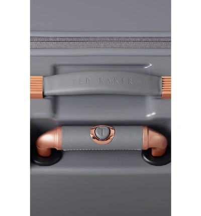 Shop Ted Baker Large Beau Bow Embossed Four-wheel 31-inch Trolley Suitcase - Grey