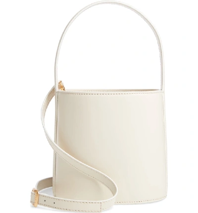 Shop Staud Bissett Leather Bucket Bag In Cream