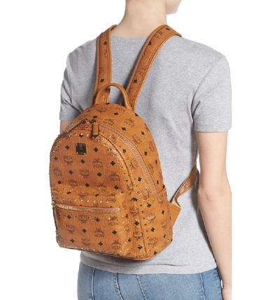 Shop Mcm Small Stark Outline Stud Leather Backpack In Cognac