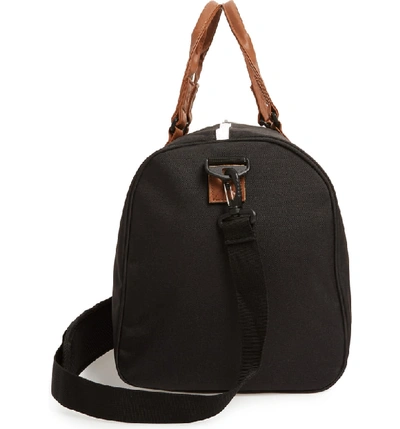 Shop Herschel Supply Co Novel Canvas Duffle Bag - Black In Black/ Tan