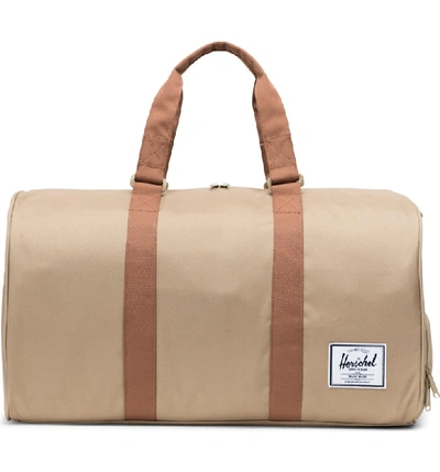 Shop Herschel Supply Co Novel Duffle Bag - Beige In Kelp/ Saddle Brown