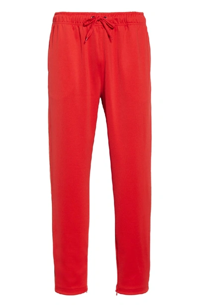 Shop Burberry Sorrento Icon Stripe Slim Fit Track Pants In Bright Red