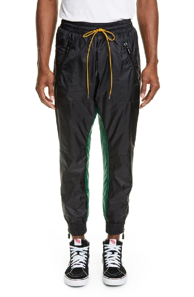 Shop Rhude Nylon Track Pants In Black/green