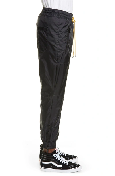 Shop Rhude Nylon Track Pants In Black/green