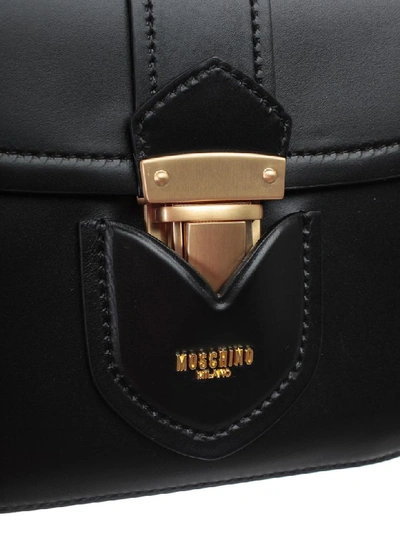 Shop Moschino Front Flap Shoulder Bag In Black