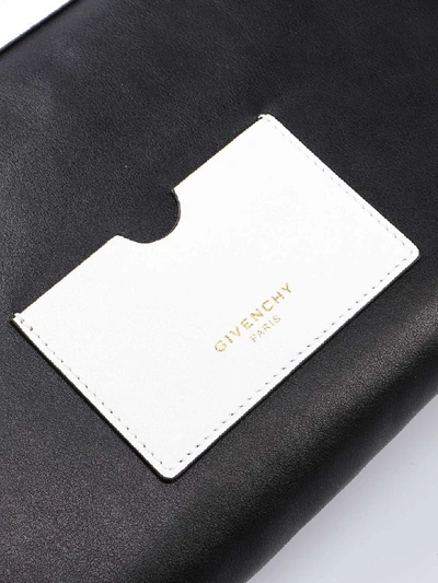 Shop Givenchy Tag Zipped Clutch In White/black