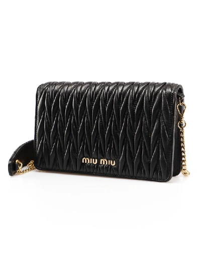 Shop Miu Miu Embellished Shoulder Bag In Nero