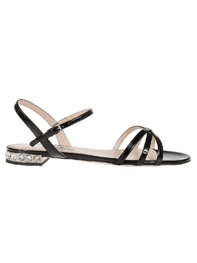 Shop Miu Miu Embellished Sandals In Black