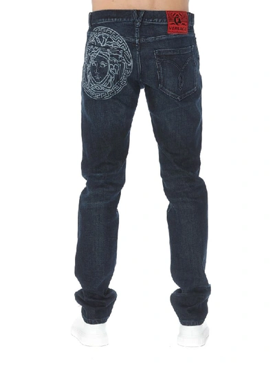 Shop Versace Logo Detail Jeans In Denim