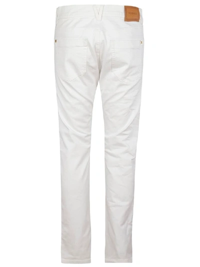 Shop Versace Classic Straight Jeans In White