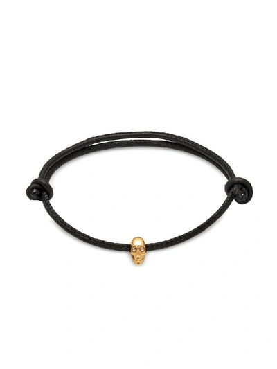 Shop Northskull Atticus Skull Gold Plated Sterling Silver And Leather Cord Bracelet In Black