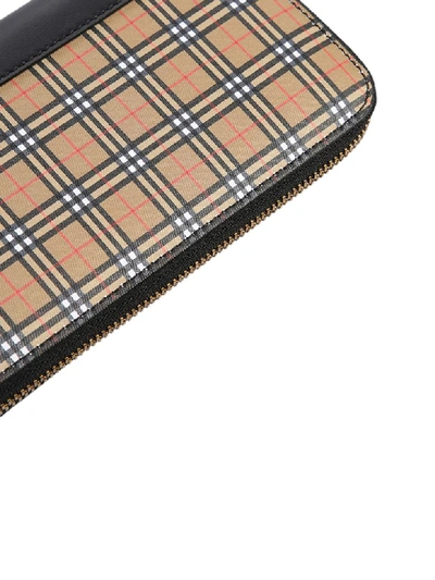 Shop Burberry Zipped Wallet In Beige