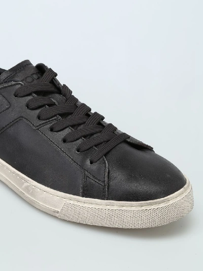 Shop Tod's Used Effect Leather Low Top Trainers In Black