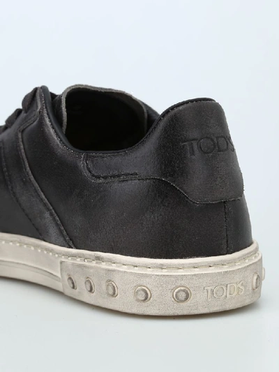 Shop Tod's Used Effect Leather Low Top Trainers In Black