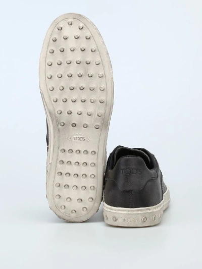 Shop Tod's Used Effect Leather Low Top Sneakers In Black