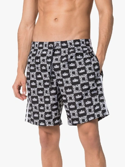 Shop Dolce & Gabbana Logo Printed Swim Shorts In Black