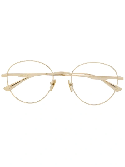 Shop Gucci Eyewear Oval Frame Glasses - Gold