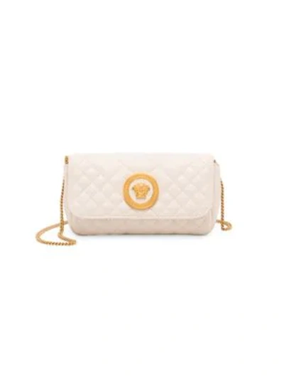 Shop Versace Quilted Leather Crossbody Bag In Off White